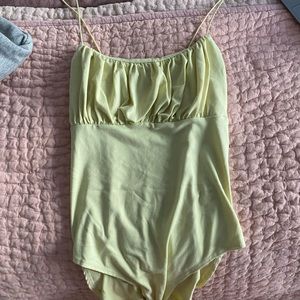 Yellow bodysuit